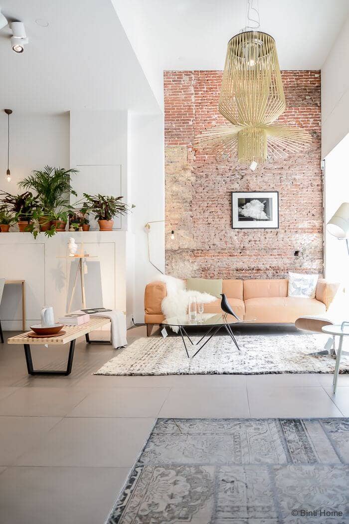 A Salmon Sofa Makes Weathered Brick Look Classy