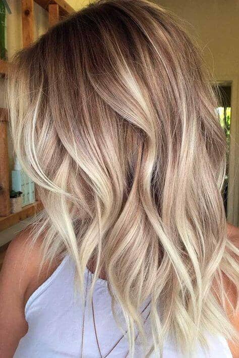 Long wavy bright blonde hair for different skin tones