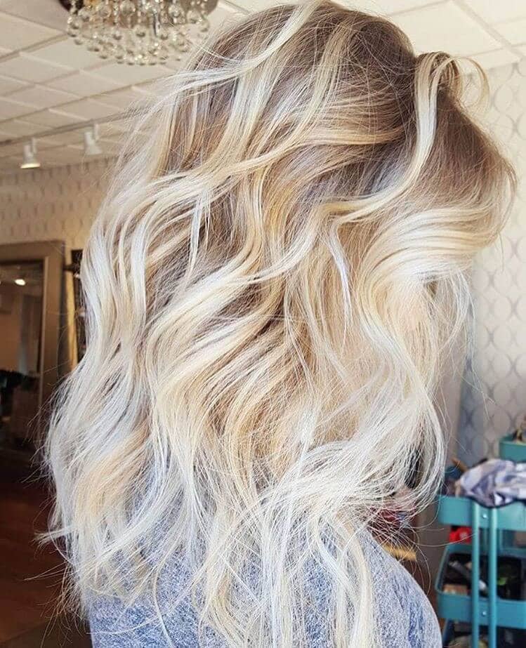 Long crazy hairstyle with blonde hair color