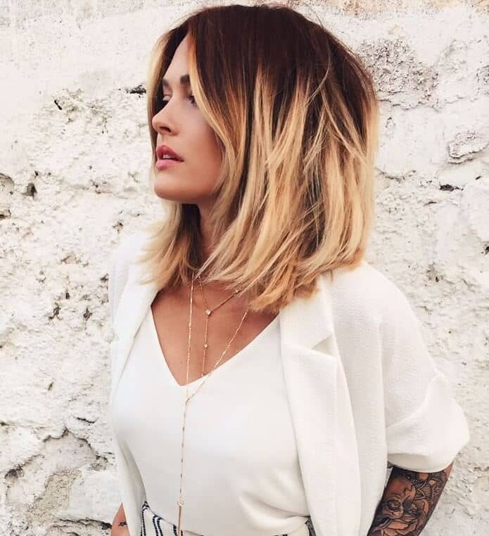 Warm blonde ombre bob with face-framing highlights