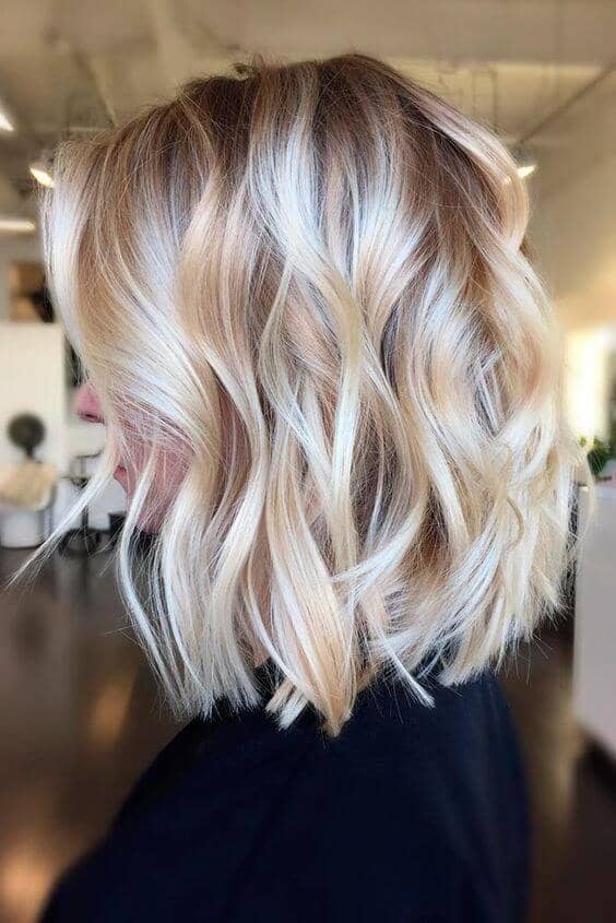 Tons of ash blonde dimension in this shoulder length do