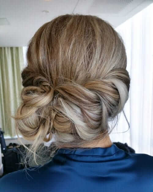 Loose Braid Crown With Low Side Chignon