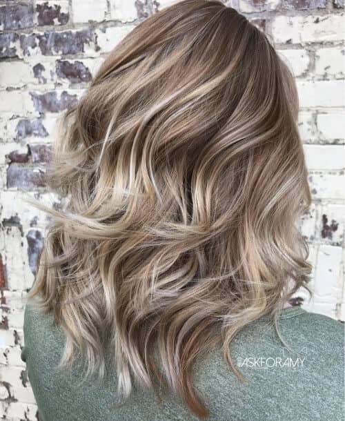 Thick Ashy Blond Layered Hair and Highlights