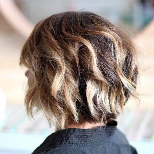 Thick, Curly Highlighted Golden Blonde Chin-length Short Blonde Bob