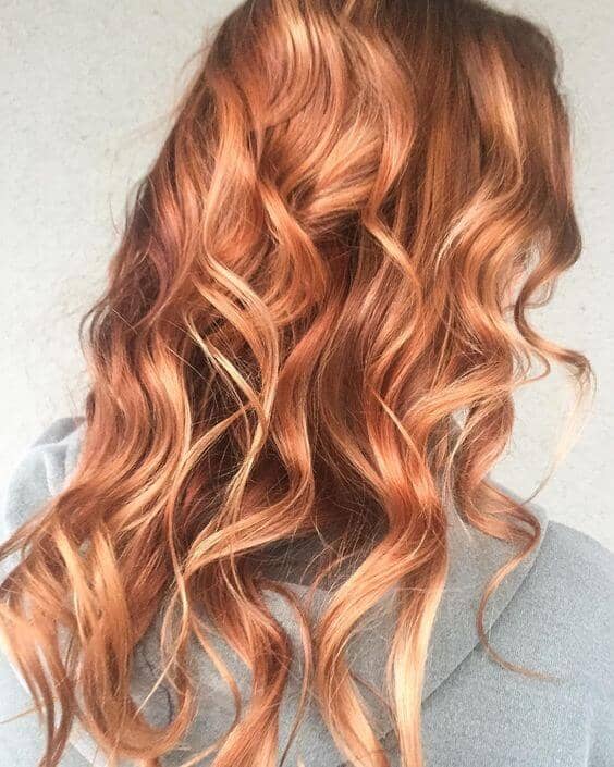 Dark blonde hair with strawberry blonde highlights. 