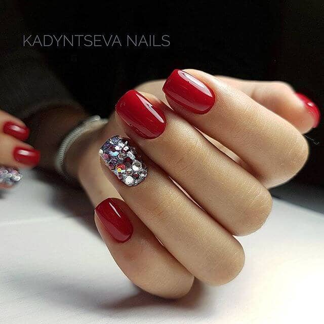 Red Nails with Glued On Crystals