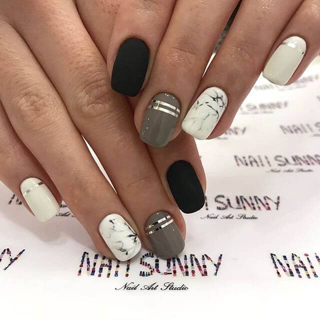 Marble, silver, and black high fashion nails