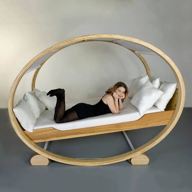 Open Frame Rocking Bed With Loads of Pillows