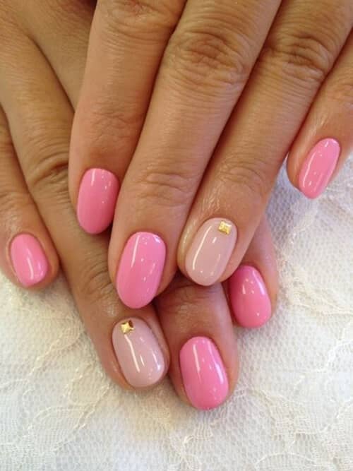 Two-Tone Pink Manicure With Gold Rivets Pink Nail Art Design