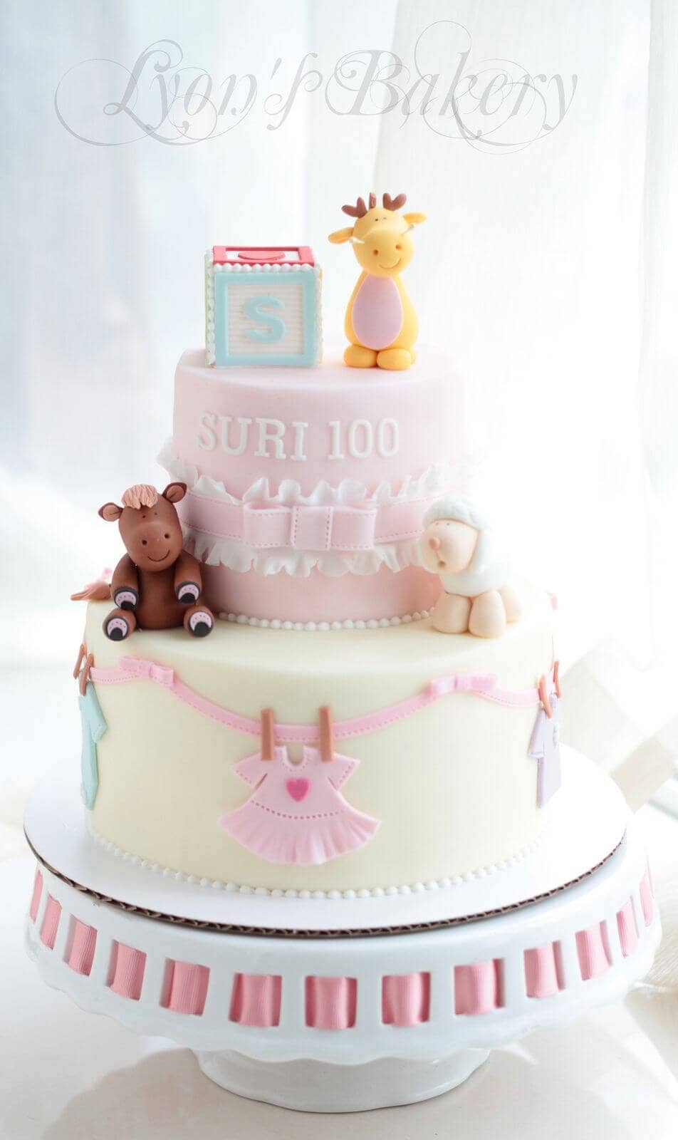 Three Animals Adorn this Baby Girl Cake