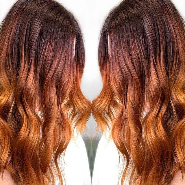 Long Red Ombre Hairdo with Bouncy Ends
