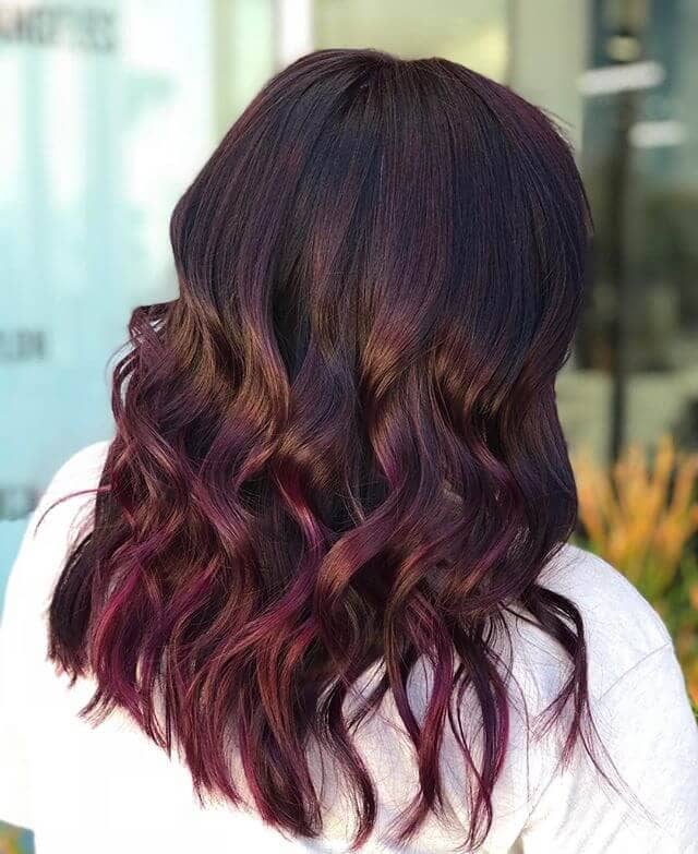 Voluminous Verticle Curls Bathed in Burgundy