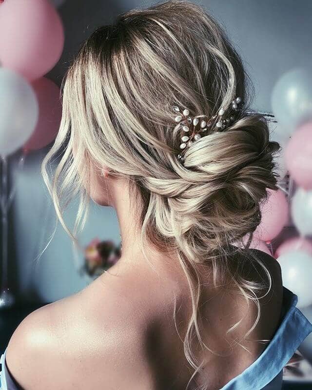 Wavy Pieces Tucked Into Low Cute Bun