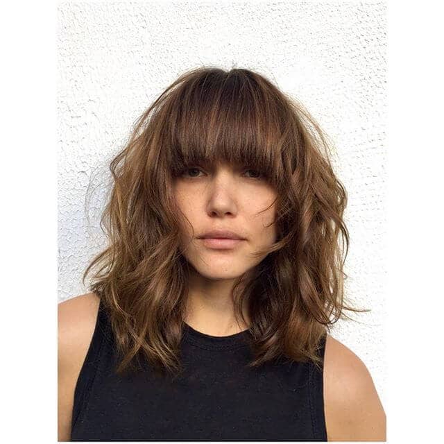 Full, Flirty Bangs and Medium Layers