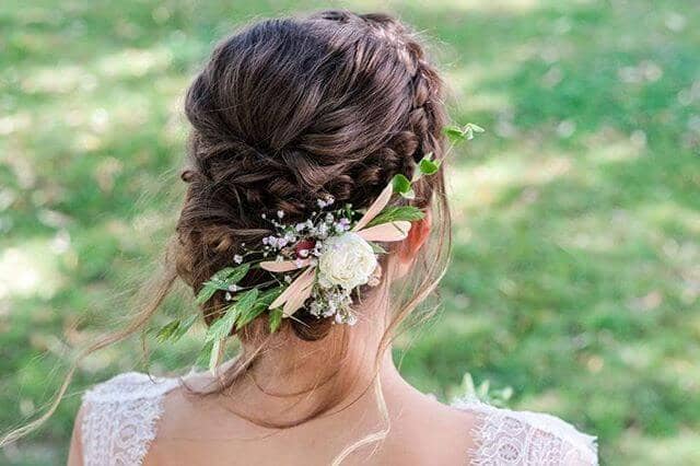 Braided Crown And Bun With Floral Feature