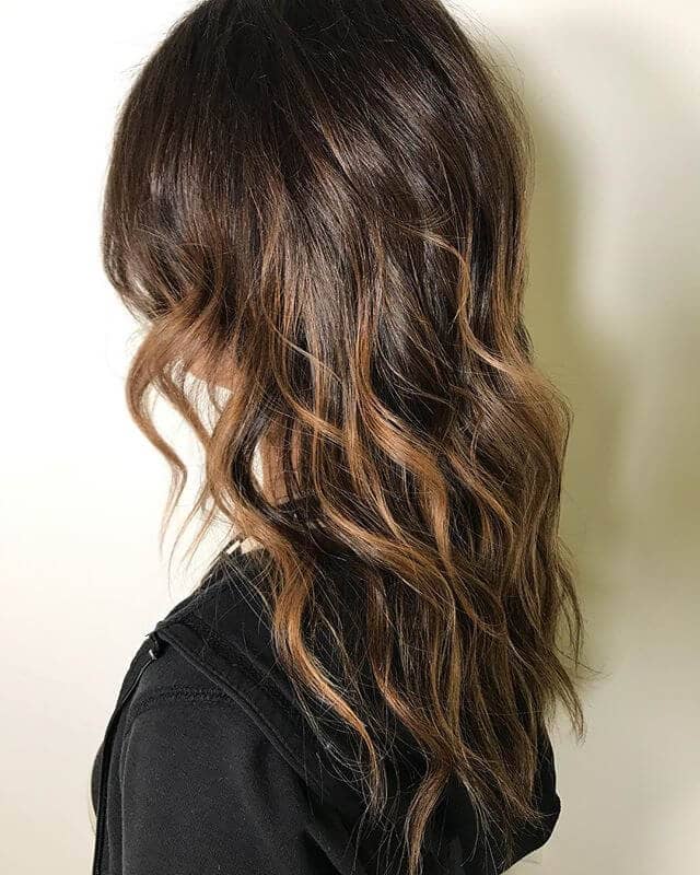 Tousled Brunette Layers with Streaky Caramel Highlights for Long Hair