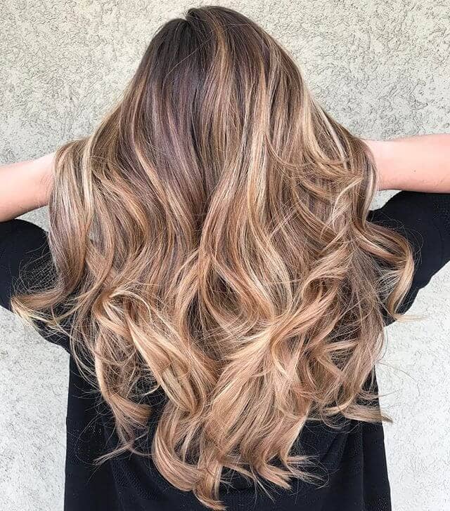 Thick Curls With Medium Blond Highlights