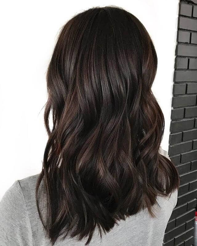 Lengthy, Stretched Dark Brown Hair with Waves