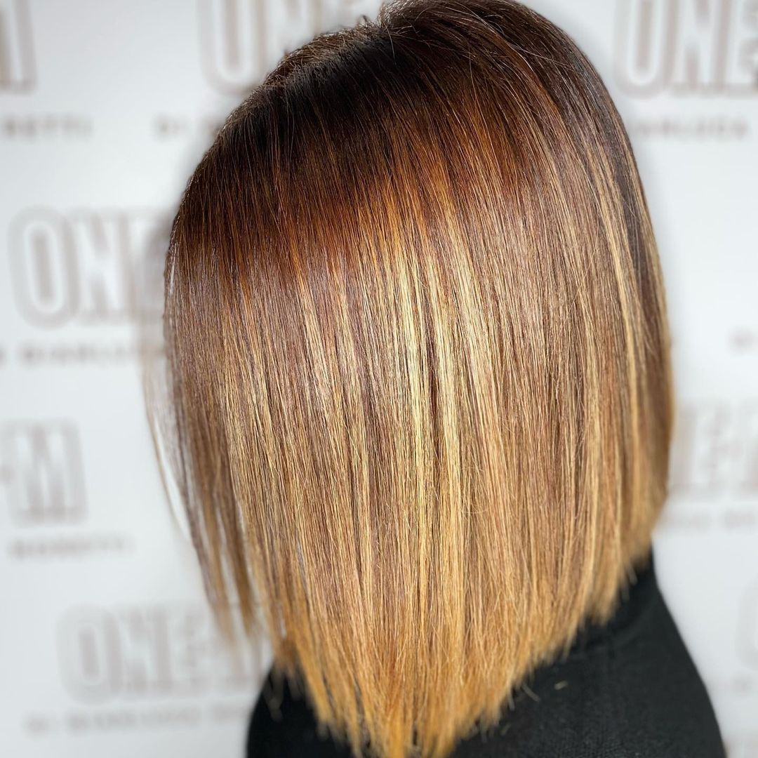  Undefined Straight Bob Hairstyle with Deep Amber Highlights