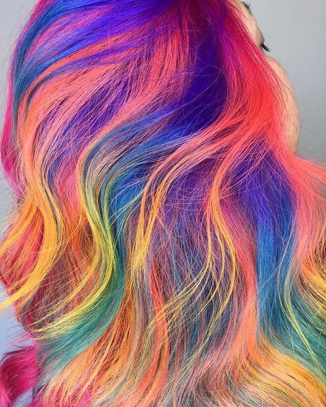 Vibrant Rainbow Streaks in Long Soft Curls