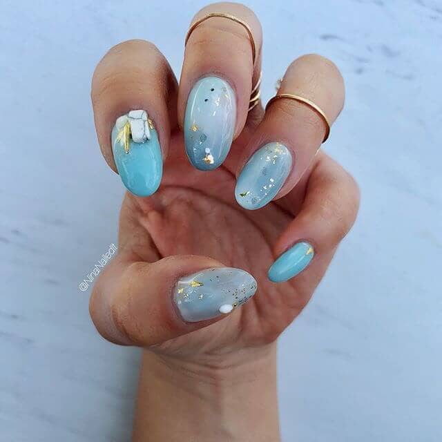 Decked out Aquamarine Swirled Nails