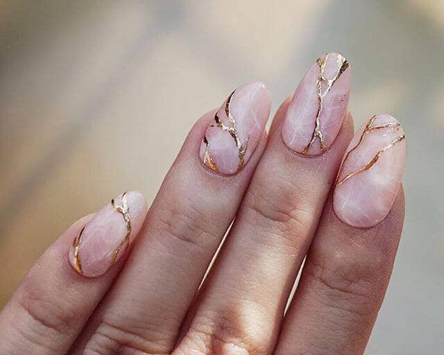 Translucent Rounded Nails with Gold Marbling