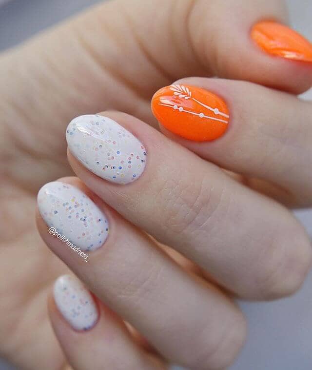 Confetti Milky White Nails with Bright Orange Decorated Accents