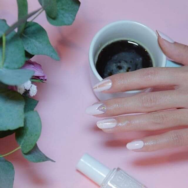 Inspired Beauty: Triangular Accented Round Milky White Nails