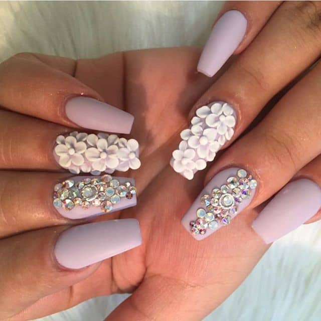 Pastel Nails with Gems and Floral Accents