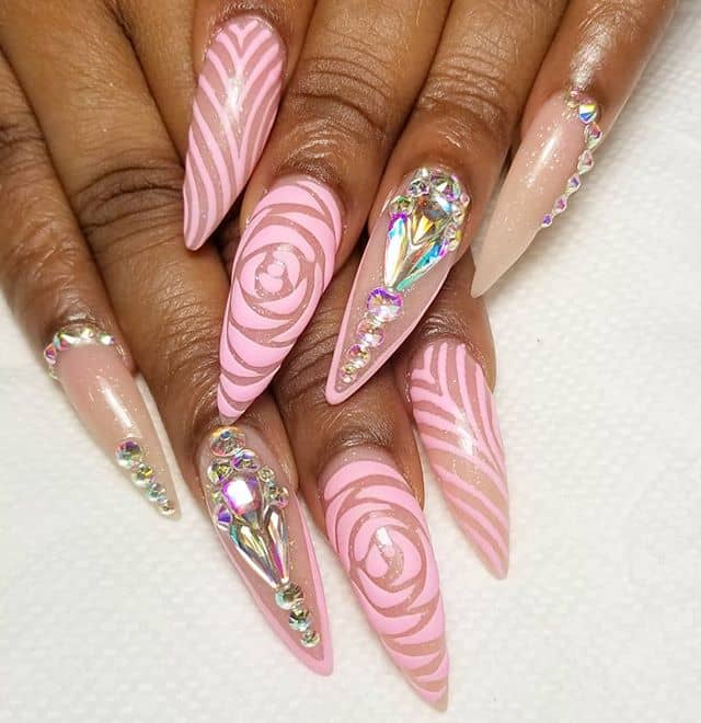 Over-the-top Pink Stiletto Nails with Prismatic Rhinestone Accents