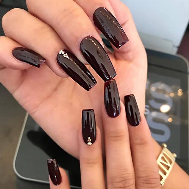 Long, Shiny Maroon Nails with Small Gems