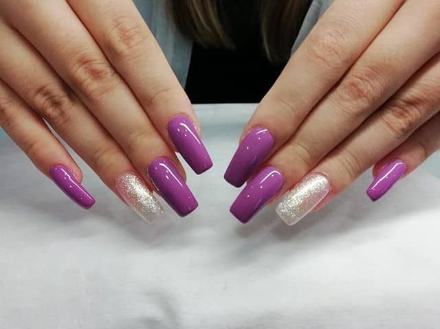 Elegant Fuchsia Nails with a Glittery Accent