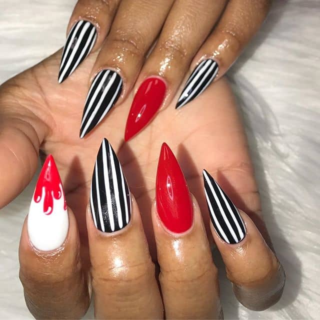 Stiletto Nails: What is Black and White and Red All-over? Black Stiletto Nails
