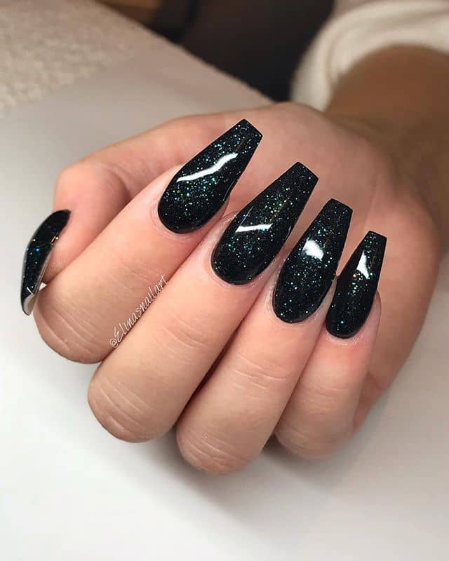Black Nails with a Cosmic Sparkle