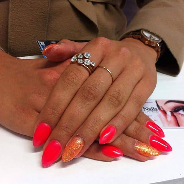 Fiery Red and Orange Nails with Glitter Accen