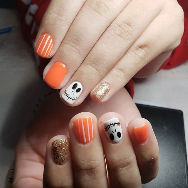 Skull, Stripes, and Sparkles Halloween Orange Nails