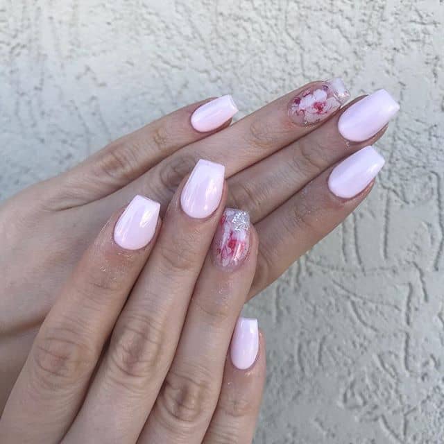 Pale Pink Nails with a Floral Accent