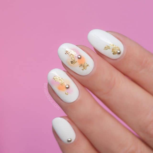 A Unique Foiled Manicure with Sporadic Studs