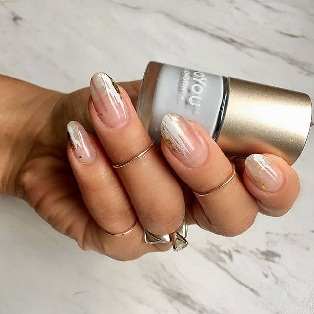 A Chic, Clear Manicure with Subtle Detailing