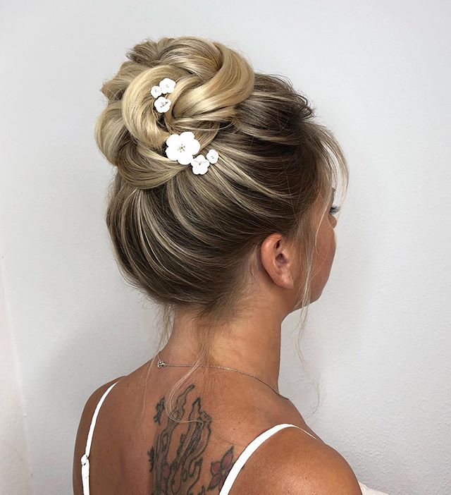 This Twisted Floral Boho Bun is one of the Best Bridal Hairstyle Ideas
