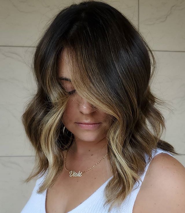  Flirty Over-the-Face Waves with Blonde Highlights