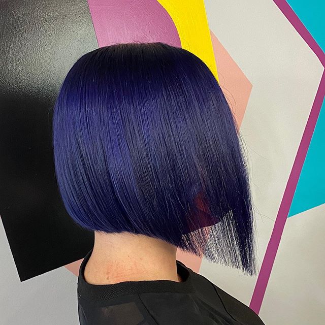 Curved Over-the-Shoulder Asymmetrical Look with Purple Tones