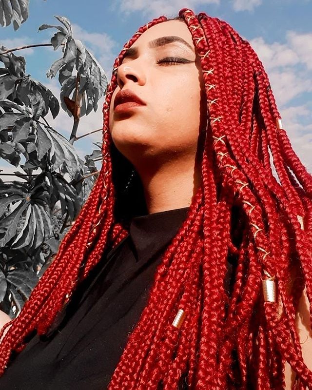 Red braids with thread and beads