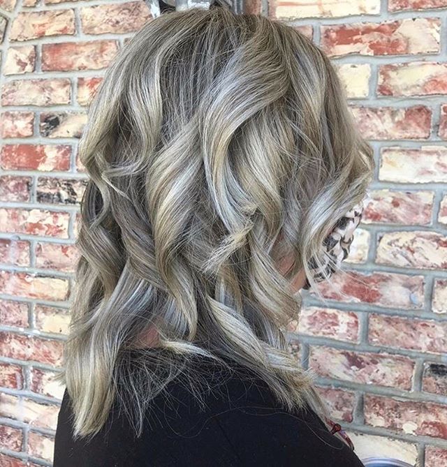 Ash-Blonde Piecey Curls with Heavy Layers