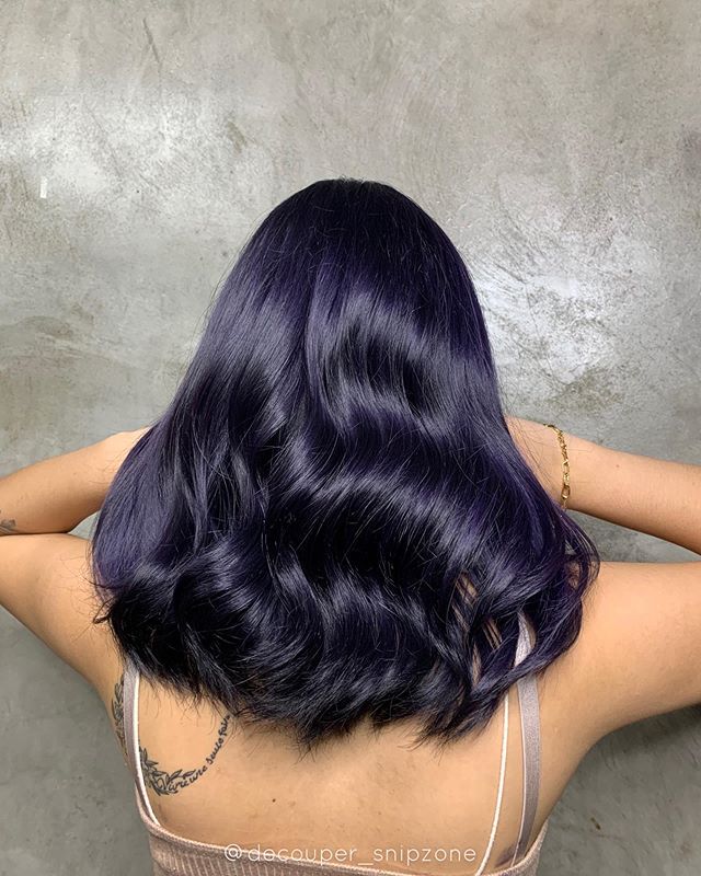 Light Purple Hair with Mid Length Curls with Purple Highlights