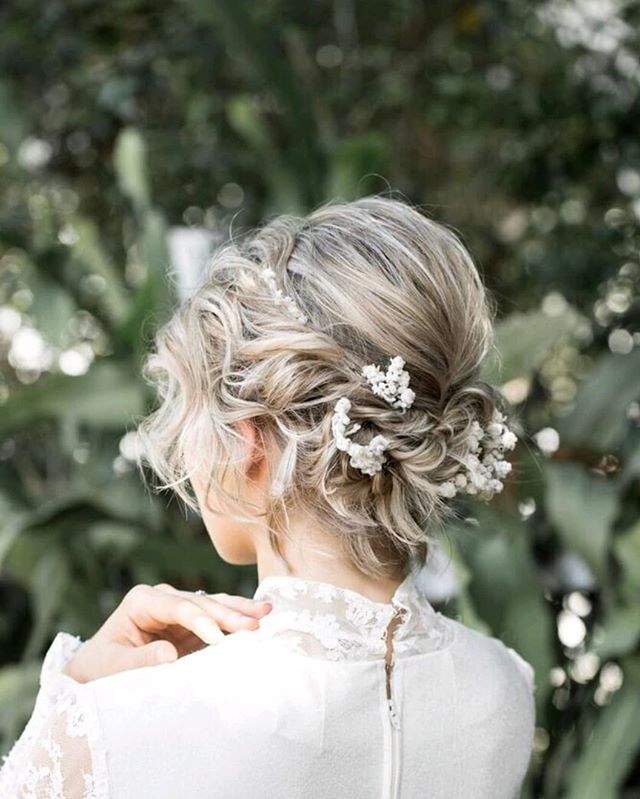 Flowers Braided Into Natural Wavy Bun