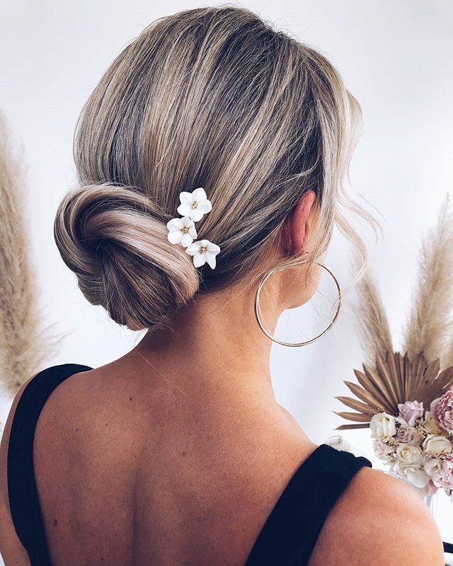 Simple Low Bun With A Tasteful Accessory