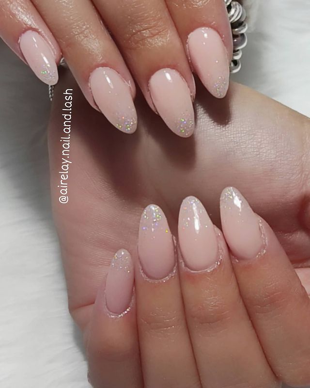 Nude Nail Idea: Pale Pink Almond Nude Nails with Shimmery Embellishments