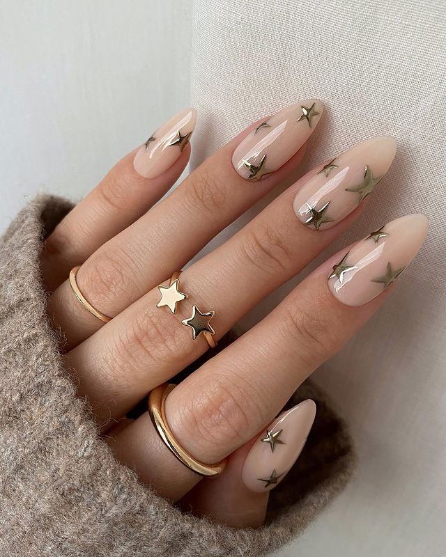Pale Pink Stiletto Rose Gold Nail Designs with Soft Gold Stars