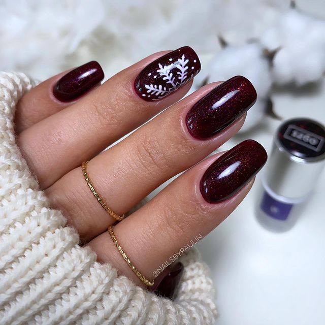 Glimmering and Trendy Burgundy Nail Designs with Snowflakes